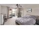 Serene bedroom featuring patio access with hot tub, gym equipment and comfortable furnishings at 1436 Via Merano St, Henderson, NV 89052