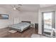 Comfortable primary bedroom with hardwood floors, ample natural light, and balcony access at 1436 Via Merano St, Henderson, NV 89052