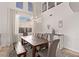 Sun-filled dining area featuring a modern chandelier, and views of the backyard at 1436 Via Merano St, Henderson, NV 89052