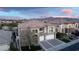 Elegant two-story house showcasing a spacious three-car garage, a stone entrance, and meticulous landscaping at 1436 Via Merano St, Henderson, NV 89052