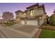 Two-story home featuring a three-car garage, neutral color palette, and charming architectural details at 1436 Via Merano St, Henderson, NV 89052