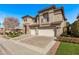 Attractive two-story home boasting a three-car garage, tasteful stone accents, and a well-maintained yard at 1436 Via Merano St, Henderson, NV 89052