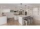 Modern kitchen with white cabinets, stainless steel appliances, and double islands at 1436 Via Merano St, Henderson, NV 89052