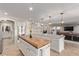 Gourmet kitchen with stainless appliances and hardwood island at 1436 Via Merano St, Henderson, NV 89052
