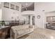 The bright living room boasts travertine floors, high ceilings, and a seamless connection to the dining area at 1436 Via Merano St, Henderson, NV 89052