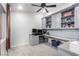 Functional home office with built-in shelving, cabinets, and desk space, perfect for productivity at 1436 Via Merano St, Henderson, NV 89052
