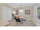 Bright dining area featuring a round table and chairs, natural lighting, and neutral color palette at 2054 Wildwood Lake St, Henderson, NV 89052