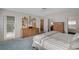 Bedroom featuring carpeted floors, access to the bathroom, and built-in dressers at 208 Stonewood, Las Vegas, NV 89107