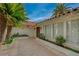 A welcoming entrance features a stone pathway, tasteful landscaping, and the home's textured facade at 208 Stonewood, Las Vegas, NV 89107