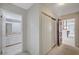 Hallway featuring a closet and doorways to the bathroom and a bedroom at 208 Stonewood, Las Vegas, NV 89107