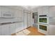 Well-equipped kitchen with white cabinets, stainless appliances, and modern design at 208 Stonewood, Las Vegas, NV 89107