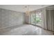 Bright living room featuring a chandelier and double doors to the backyard at 208 Stonewood, Las Vegas, NV 89107