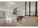 Open living area featuring tiled flooring, a decorative divider, and French doors leading to the exterior at 208 Stonewood, Las Vegas, NV 89107