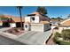 This shows the garage, driveway, and exterior of the home at 2108 Running River Rd, Henderson, NV 89074