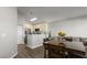 Modern kitchen open to the dining area, with stainless steel appliances and ample counter space for cooking at 2108 Running River Rd, Henderson, NV 89074