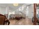 Bright living room with soaring ceilings, chandelier, wood floors and staircase to the upper level at 2108 Running River Rd, Henderson, NV 89074