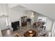 Spacious and bright, open-concept living area featuring wood floors, elegant furniture, and a cozy atmosphere at 2108 Running River Rd, Henderson, NV 89074