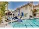 Backyard with a pool, jacuzzi, patio, and lounge seating at 2508 Monarch Bay Dr, Las Vegas, NV 89128