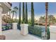 Balcony overlooking the street with iron railing, featuring lush landscaping at 2508 Monarch Bay Dr, Las Vegas, NV 89128