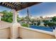Balcony view with pergola, showcasing the neighborhood and desert landscaping at 2508 Monarch Bay Dr, Las Vegas, NV 89128