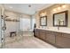 Elegant bathroom boasts double vanity, soaking tub, and a separate glass enclosed shower at 2508 Monarch Bay Dr, Las Vegas, NV 89128