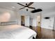 Spacious bedroom features hardwood floors, ceiling fan, and ensuite bathroom access at 2508 Monarch Bay Dr, Las Vegas, NV 89128