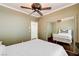 Bedroom features hardwood floors, ceiling fan, and closet with mirror doors at 2508 Monarch Bay Dr, Las Vegas, NV 89128