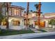 Stunning two-story home with a well-manicured lawn and a cozy entrance at 2508 Monarch Bay Dr, Las Vegas, NV 89128