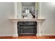 Elegant fireplace featuring white pillars and dark marble at 2508 Monarch Bay Dr, Las Vegas, NV 89128