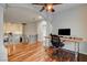Upstairs landing with hardwood floors features column and home office with natural light at 2508 Monarch Bay Dr, Las Vegas, NV 89128