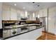 Bright kitchen featuring stainless appliances, granite counters, and a stylish breakfast bar at 2508 Monarch Bay Dr, Las Vegas, NV 89128
