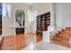 Spacious living room with hardwood floors, built-in shelving, and a fireplace at 2508 Monarch Bay Dr, Las Vegas, NV 89128