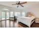Main bedroom featuring hardwood floors, bright windows, and a seating area at 2508 Monarch Bay Dr, Las Vegas, NV 89128