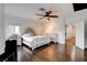 Bright and spacious main bedroom with a large bed, hardwood floors, and natural light at 2508 Monarch Bay Dr, Las Vegas, NV 89128