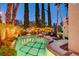 Backyard pool featuring a spa, lounge chairs, and string lights at 2508 Monarch Bay Dr, Las Vegas, NV 89128