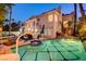 Inviting pool with inset spa, basketball hoop, and backyard lounge area at 2508 Monarch Bay Dr, Las Vegas, NV 89128