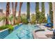 Backyard pool area featuring mature landscaping, tall desert trees, and tile at 2508 Monarch Bay Dr, Las Vegas, NV 89128