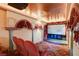 Home theater with tiered seating, plush velvet decor, and a large screen at 2508 Monarch Bay Dr, Las Vegas, NV 89128