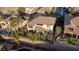 An aerial shot shows a neatly organized suburban neighborhood with houses featuring well-maintained yards and nearby amenities at 2737 Josephine Dr, Henderson, NV 89044