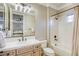 Bright bathroom showcasing a shower-tub combo, vanity, and a large mirror at 2737 Josephine Dr, Henderson, NV 89044