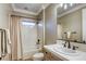 Well-lit bathroom featuring a shower-tub combo and vanity with designer fixtures at 2737 Josephine Dr, Henderson, NV 89044