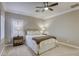 Relaxing bedroom featuring plush carpeting, a ceiling fan, and neutral decor, creating a warm and inviting space at 2737 Josephine Dr, Henderson, NV 89044