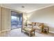Cozy bedroom with balcony access, neutral walls, and plush carpeting at 2737 Josephine Dr, Henderson, NV 89044