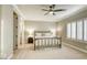This bedroom boasts a ceiling fan, plush carpeting, and window shutters at 2737 Josephine Dr, Henderson, NV 89044