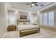 Cozy bedroom with neutral colors, tray ceiling, plantation shutters, and carpeted flooring at 2737 Josephine Dr, Henderson, NV 89044