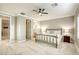 Spacious bedroom features plush carpeting, a ceiling fan, and neutral walls, creating a serene atmosphere at 2737 Josephine Dr, Henderson, NV 89044