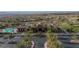 Aerial view of a community center with a pool, sports fields, and lush landscaping in a residential area at 2737 Josephine Dr, Henderson, NV 89044