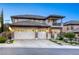 Beautiful two-story home featuring a tile roof, stone accents, and a well-maintained three-car garage at 2737 Josephine Dr, Henderson, NV 89044