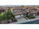 Beautiful two-story home showcasing a well-manicured front yard, three-car garage, and a charming balcony at 2737 Josephine Dr, Henderson, NV 89044