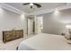 Cozy bedroom featuring soft carpet, a ceiling fan, and an ensuite bathroom, offering comfort and convenience at 2737 Josephine Dr, Henderson, NV 89044